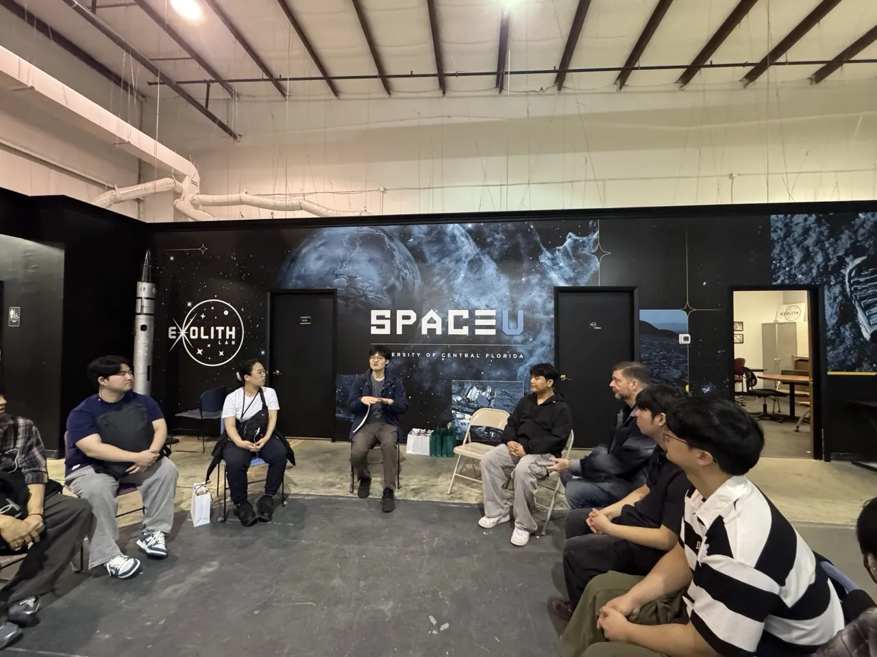 Research team at UCF Exolith Lab discussing remote rover competition and Jeju space research collaboration
