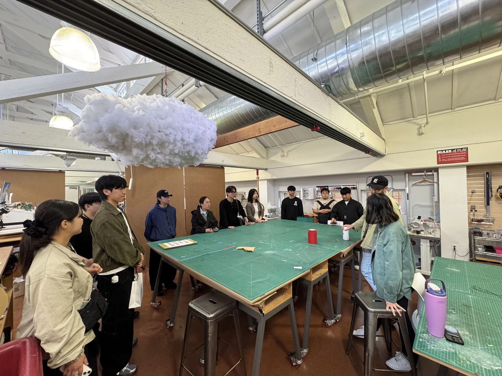 Global Space Bootcamp students sharing design thinking experiences inside Stanford d.school studio