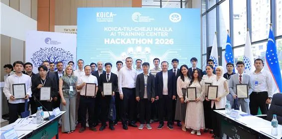 Graduates of the 2026 spring cohort holding their certificates alongside TIU and Cheju Halla University officials at the KOICA-TIU AI Training Center