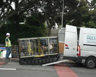 The RovoRoad unmanned repair robot and branded van on a Jeju public road during the field demonstration