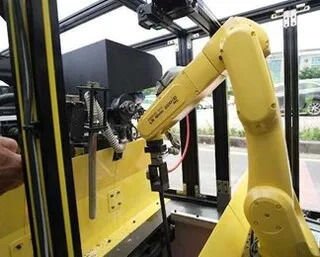 Close-up of the RovoRoad repair robot's robotic arm